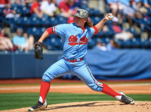 Softball pitcher in mid throw